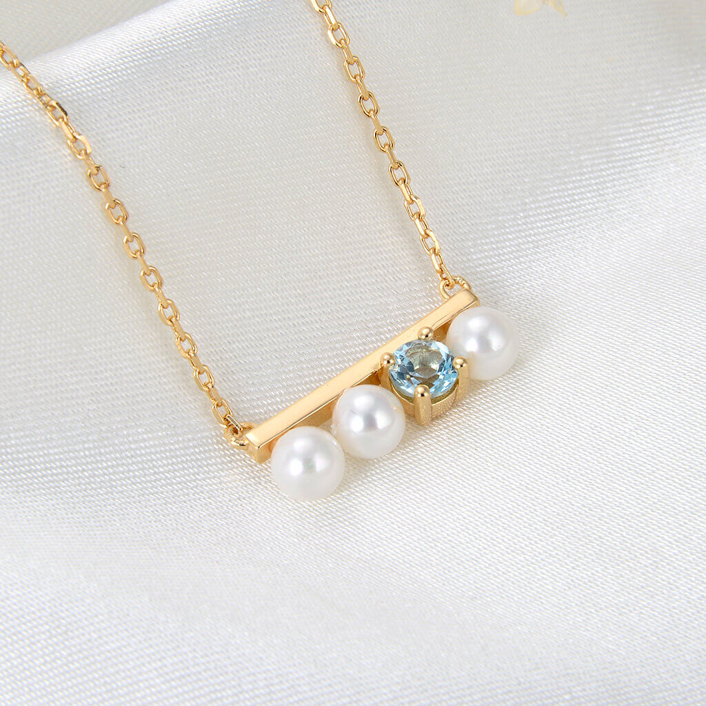Lamorvita_PearlBlueTopaz_Bar_SilverNecklace_LeftScene