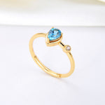 Lamorvita_SwissBlueTopaz_PearShaped_SilverRing_StandScene